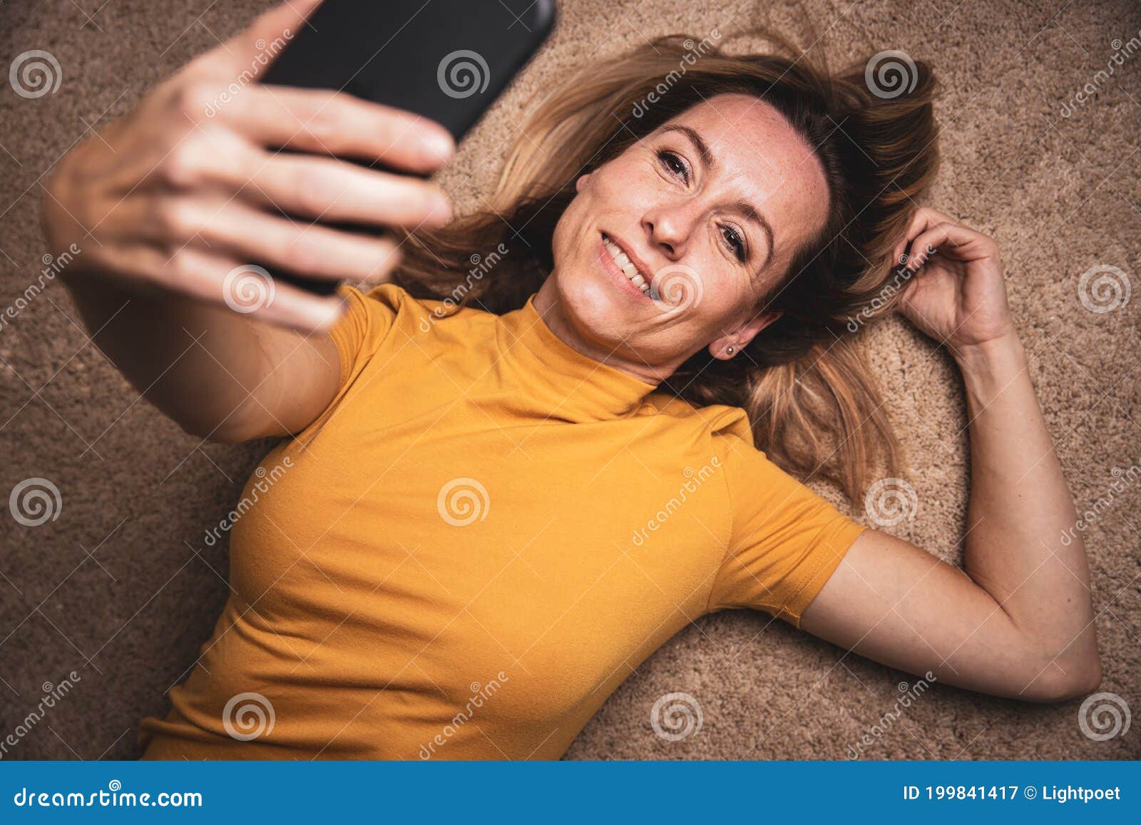 Happy Middle Aged Woman Taking Selfie With Her Smart Phone Stock Image