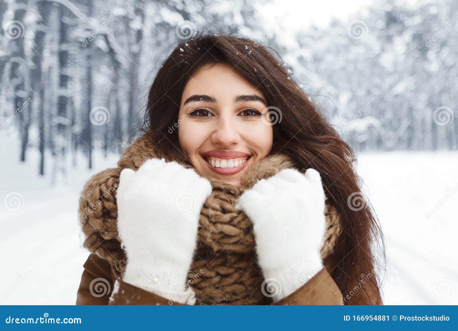 Happy Millennial Girl Touching Knitted Scarf Standing in Snowy Park ...