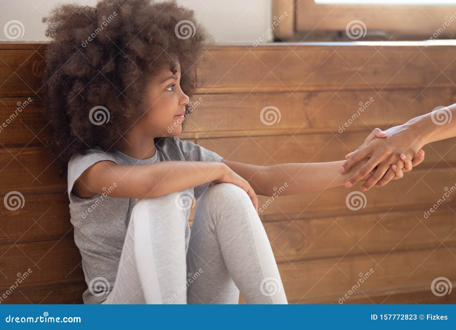 happy mixed race adorable little girl holding lent hand.