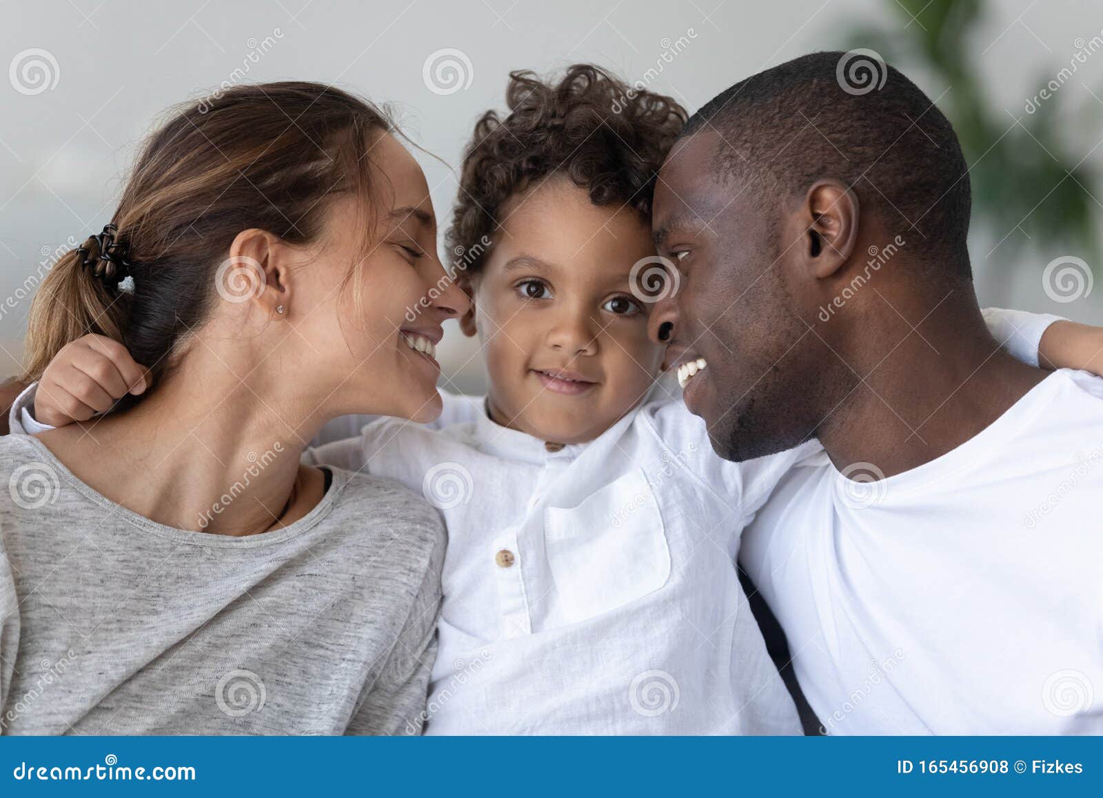happy mixed race family bonding head shot close up portrait.