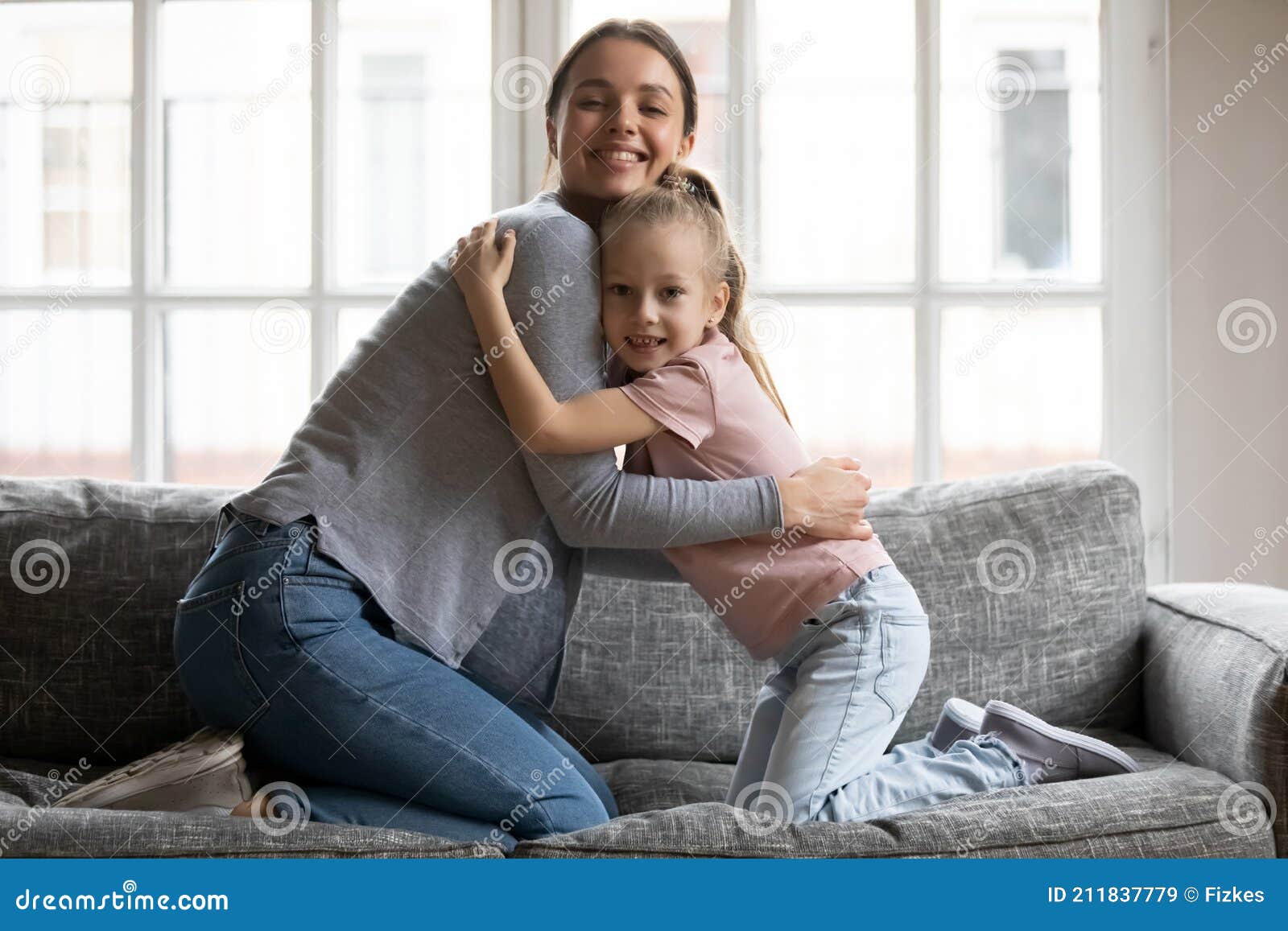 Happy Mom Cuddling Little Daughter Girl On Sofa Stock Image Image Of 