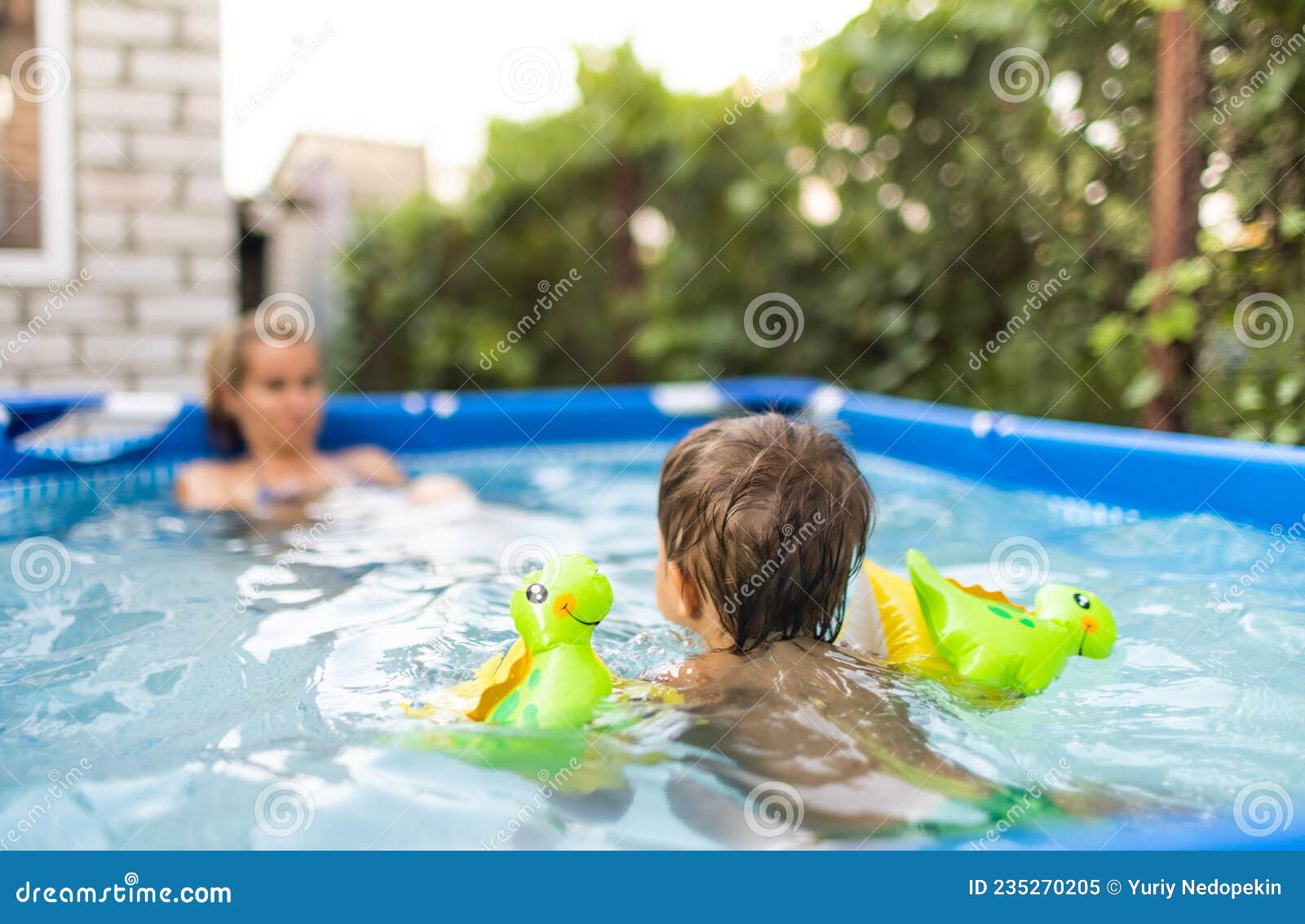 Mom Plays with a Naked Baby in Oversleeves in the Pool Against the  Background of a Summer Sunset Stock Image - Image of holiday, sunset:  235270205