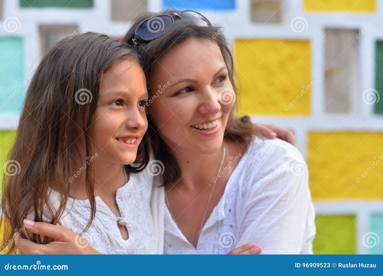happy mother and daughter hugging