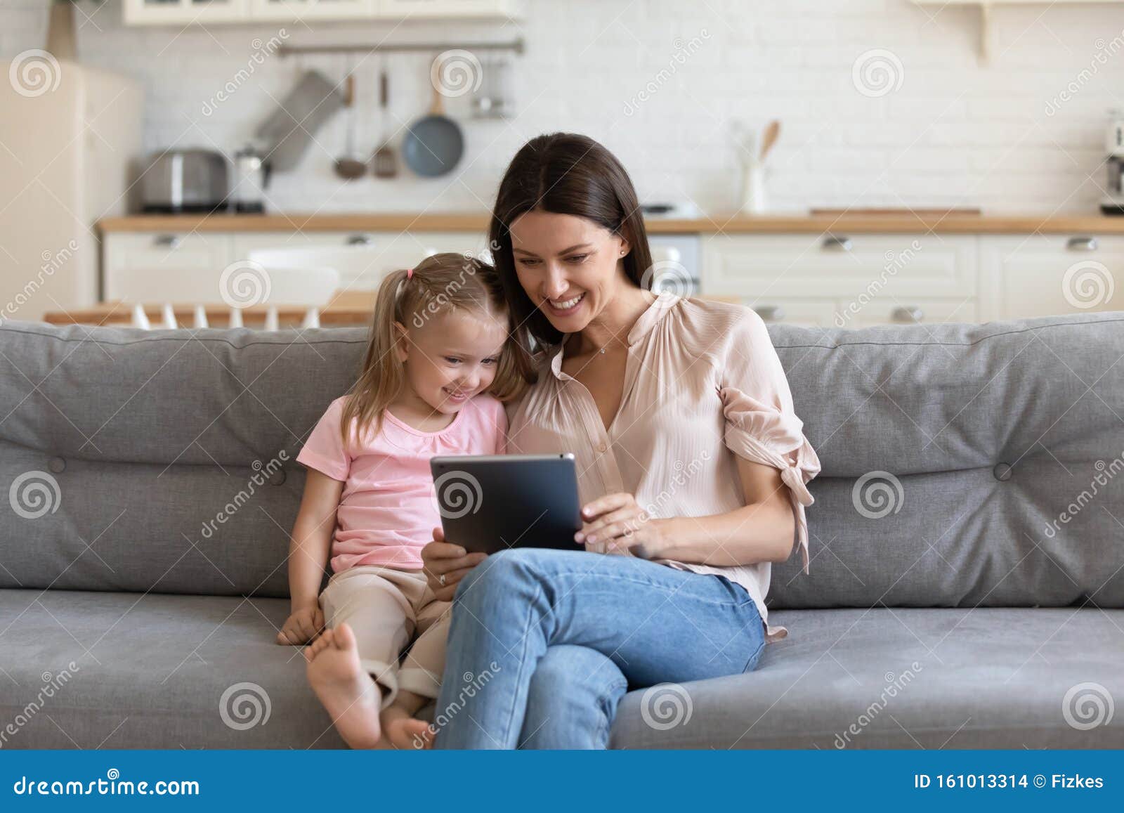 Mother And Daughter Using A Laptop Computer Stock Photo 
