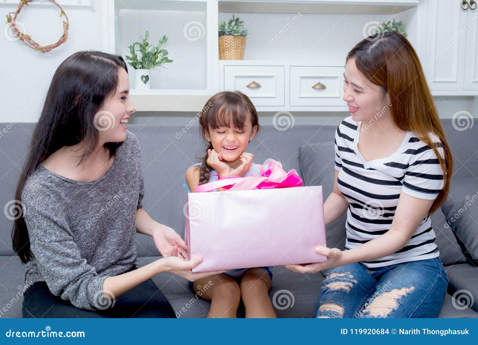 Happy of Mother and Daughter Woman Asian and Aunt with Gift with Pink  Ribbon and Daughter Kissing Mother Stock Photo - Image of asian, female:  119920684