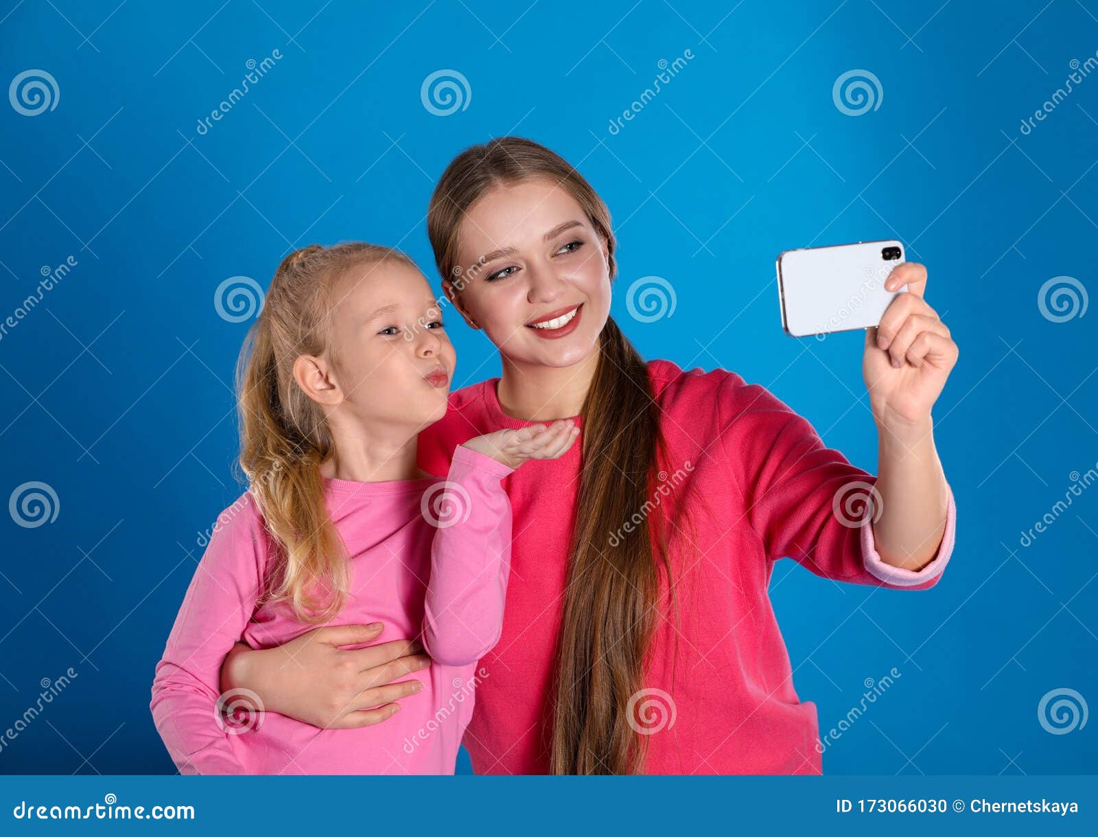 Happy Mother and Little Daughter Taking Selfie on Blue Stock Photo ...