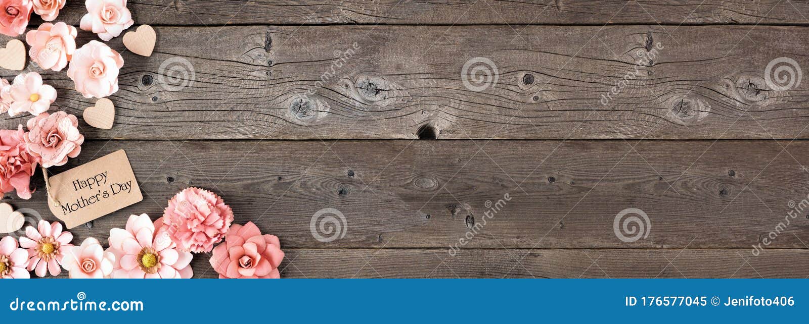 happy mothers day corner border with paper flowers and gift tag against a rustic wood banner background