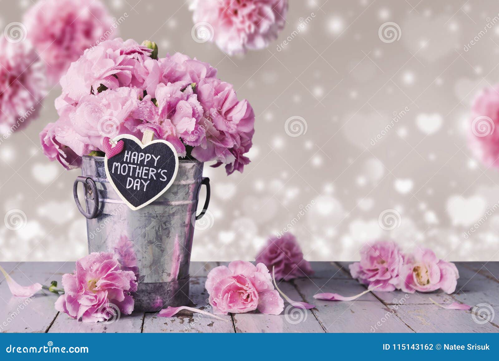 happy mothers day letter on wood heart and pink carnation flower