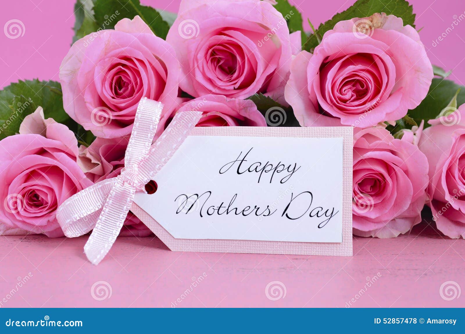 Happy Mothers Day Pink Roses background. Happy Mothers Day Pink Roses on Vintage style distressed pink wood table.