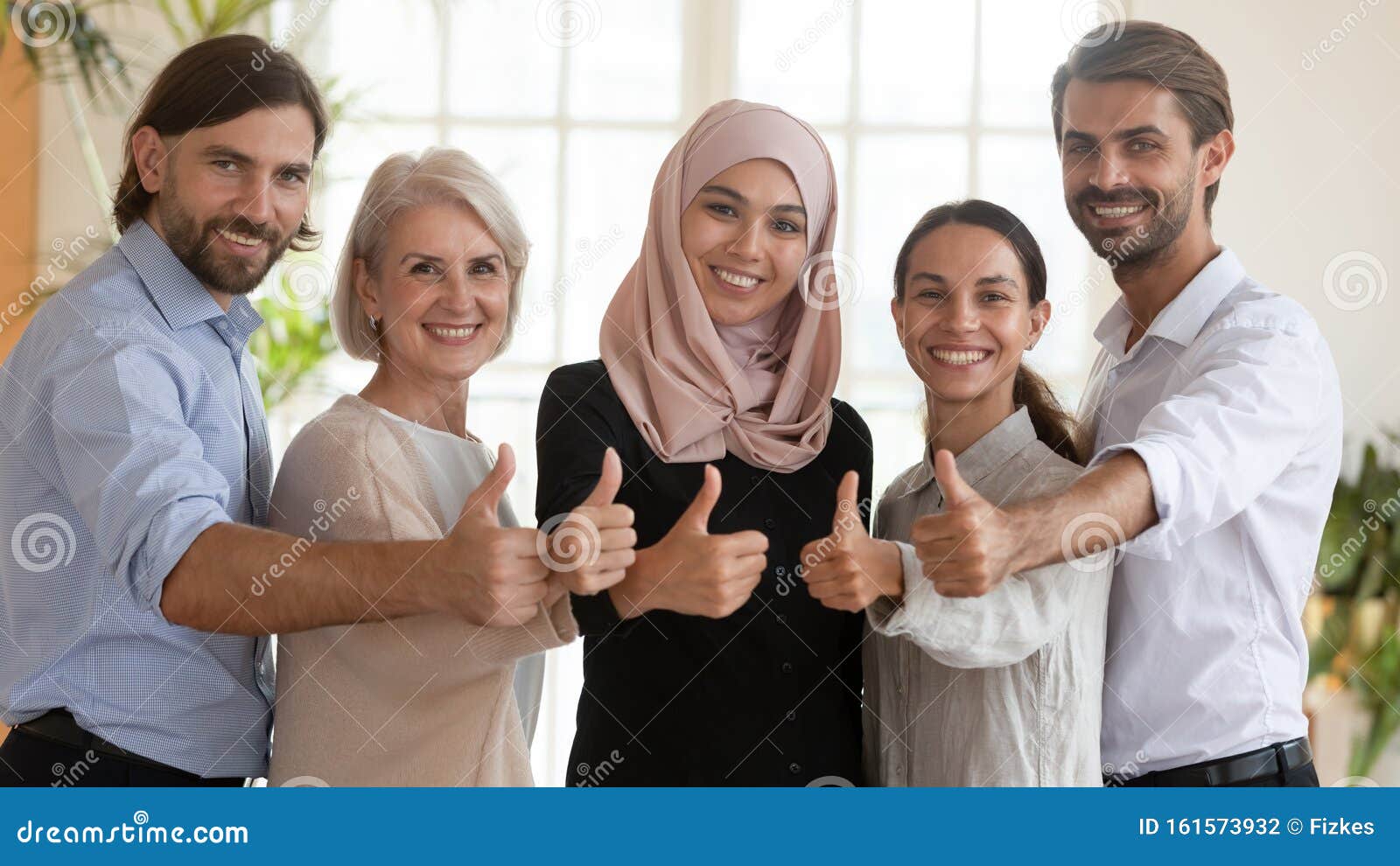 happy-multicultural-business-team-show-thumbs-up-looking-camera-happy-proud-multicultural-business-team-people-show-thumbs-up-161573932.jpg