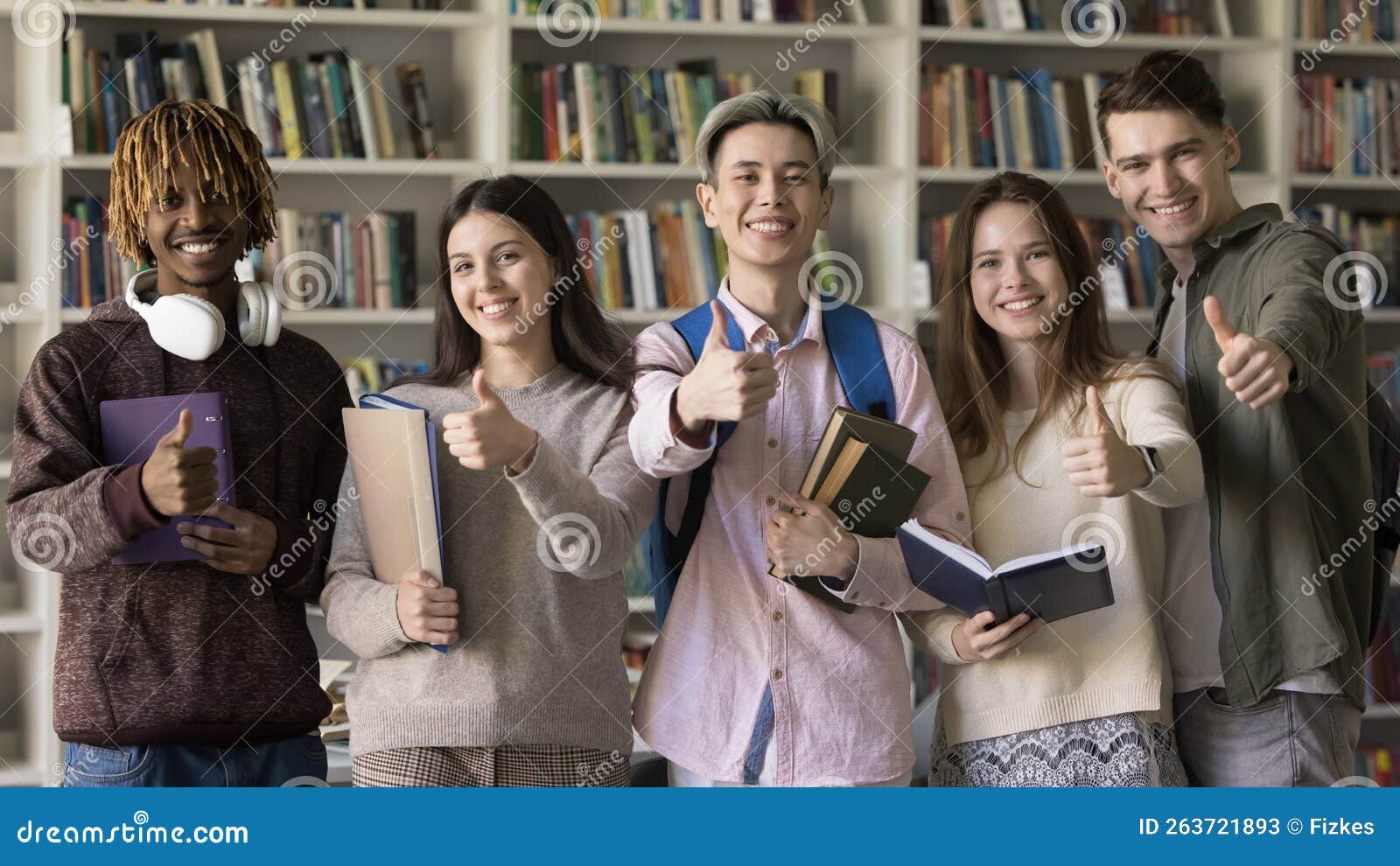 Happy Multiethnic First Year College Students Posing In University happy-multiethnic-first-year-college-students-posing-in-university