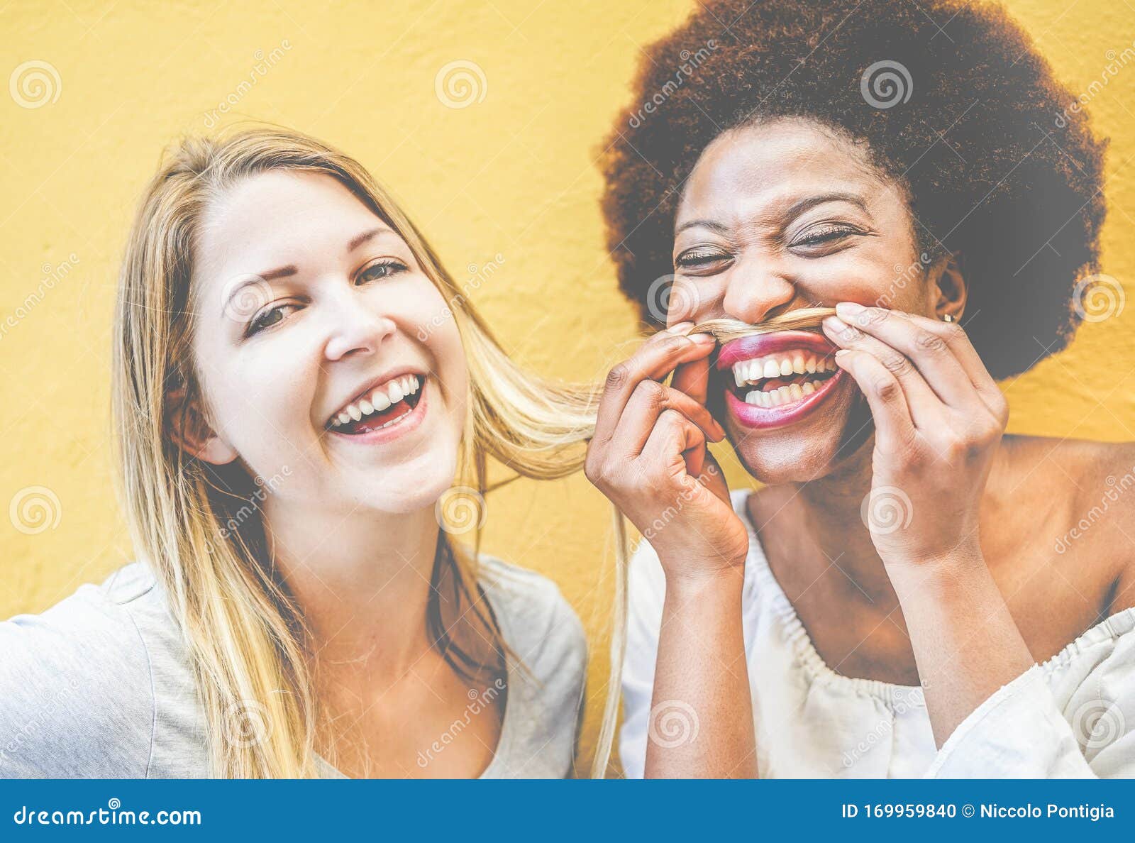 Happy Multiracial Millennials Girls Having Fun Together Playing With Hairs Young Trendy Women