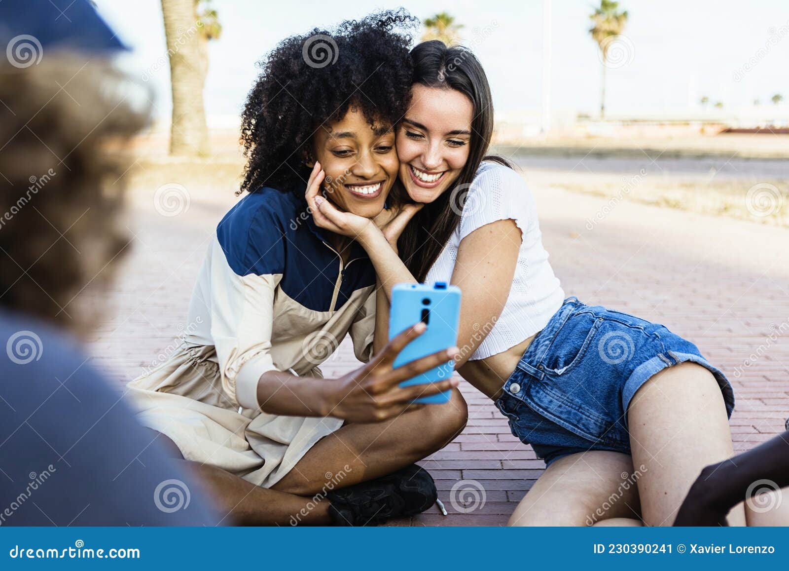 Happy Multiracial Women Friends Taking A Selfie With Smart Phone 