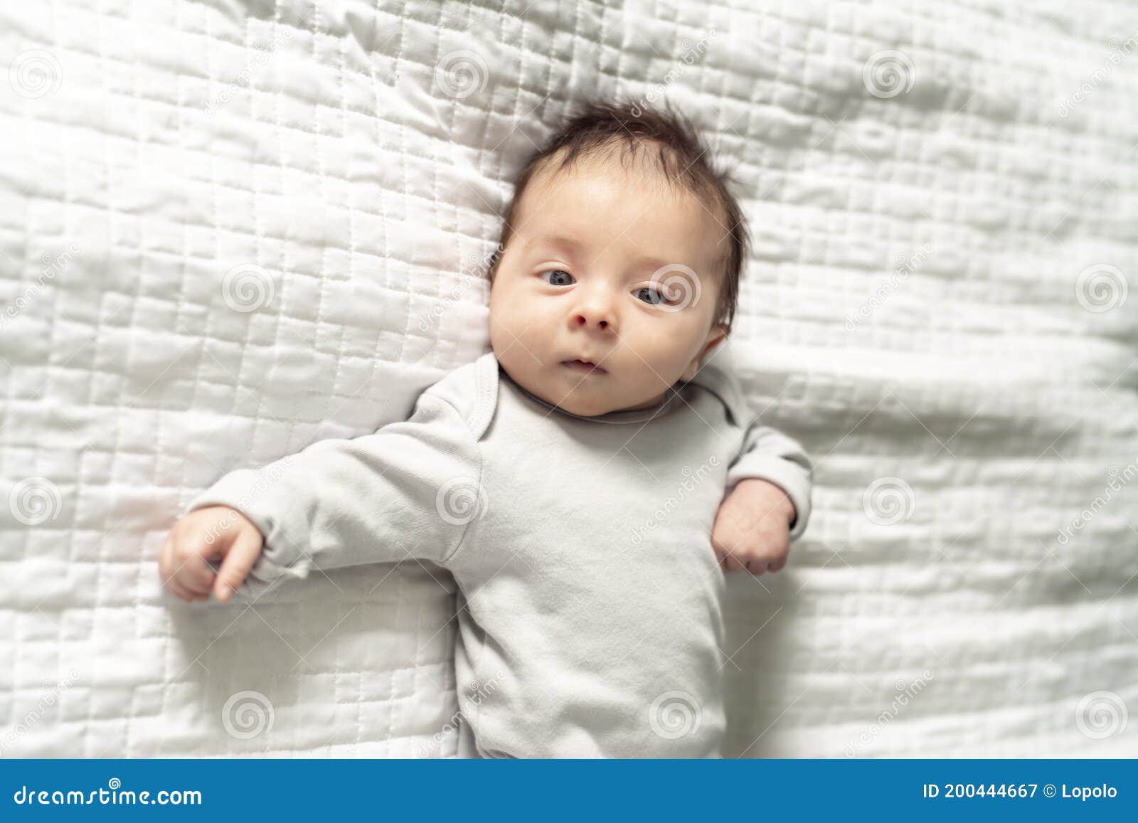 A Happy Newborn Baby on the Bed at Home Stock Image Image of lying