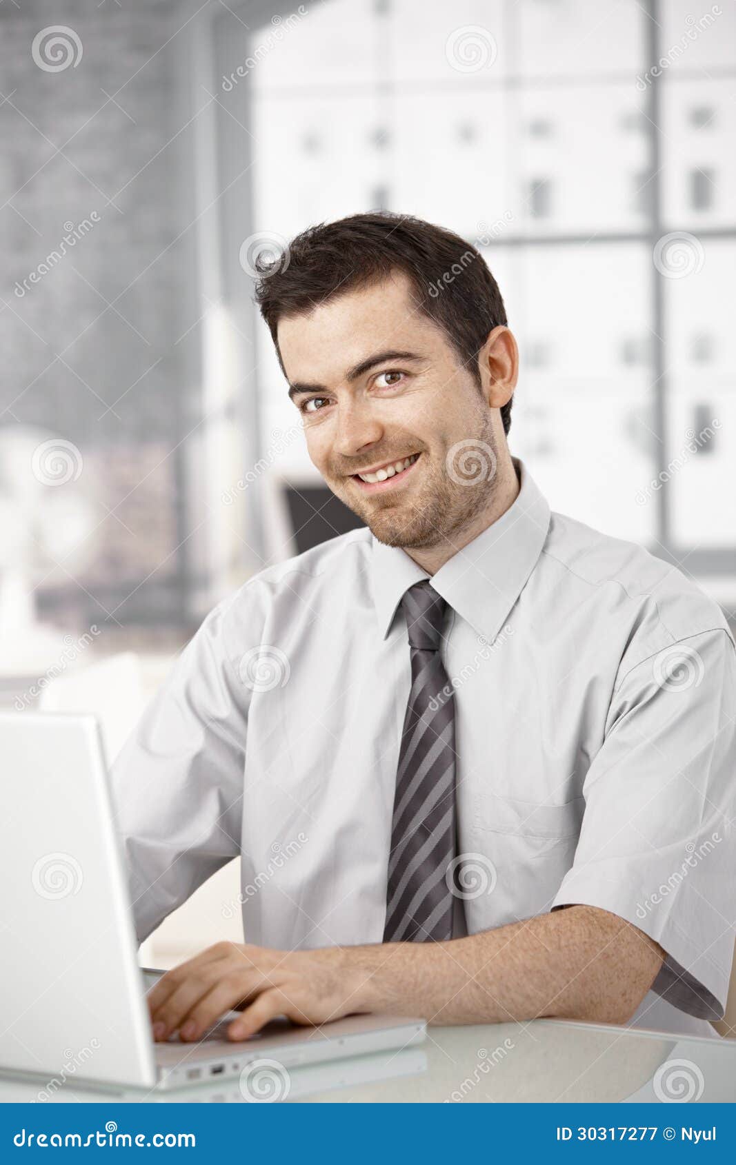 Happy Office Worker Sitting at Desk Using Laptop Stock Image - Image of  keyboard, leisure: 30317277
