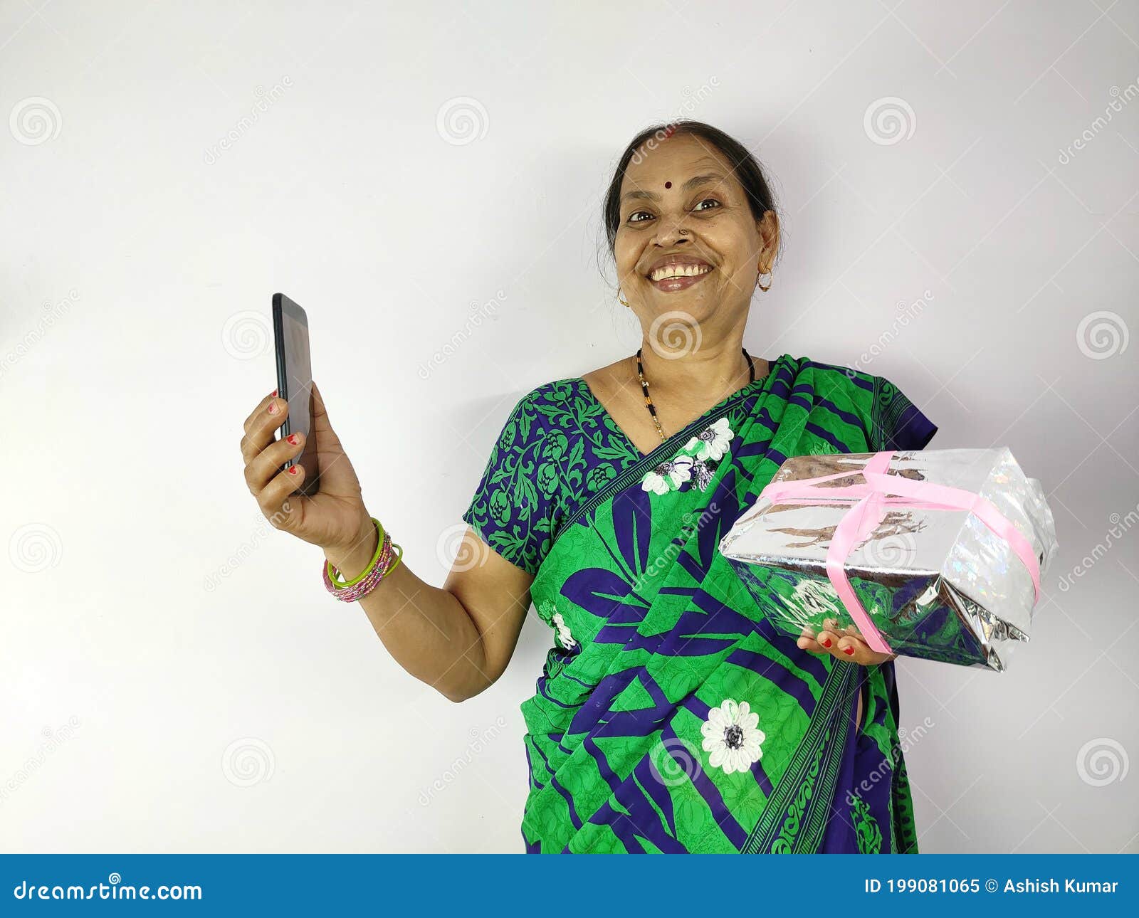 Indian Woman Celebrate Birthday Or Anniversary During Video Or Phone Call On Mobile At Home