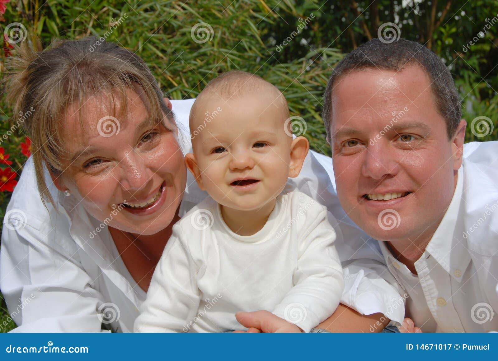Happy parents and Toddler stock image. Image of location - 14671017