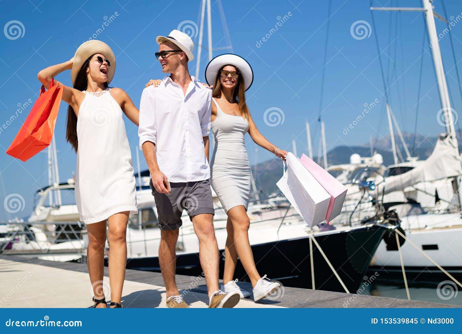 Happy People Enjoying and Having Fun on a Luxury Summer Vacation