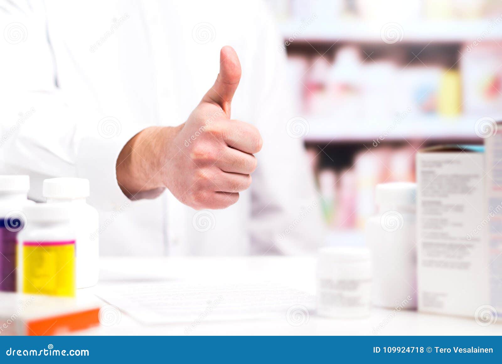 happy pharmacist showing thumbs up at pharmacy counter