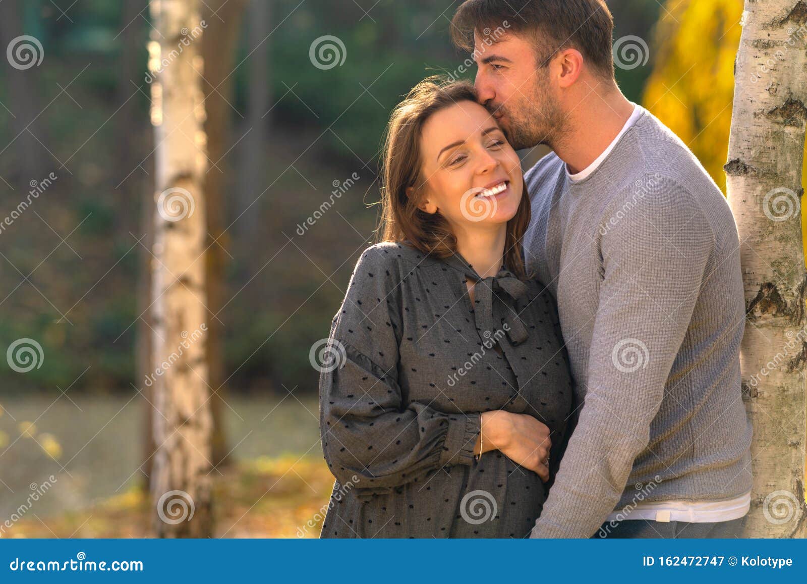 Happy Pregnant Woman Cuddling with Her Husband. Stock Image Image of
