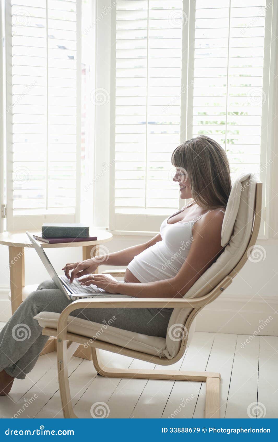 Happy Pregnant Woman Using Laptop on Chair Stock Image - Image of