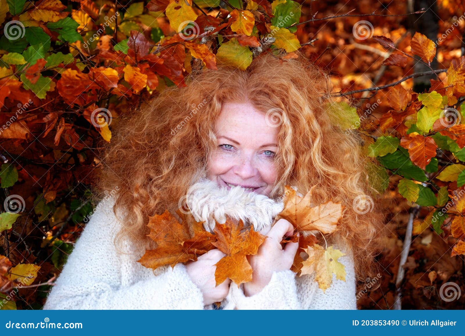 Happy Redheaded Woman Ginger In Her Best Years With Very Curly Hair 