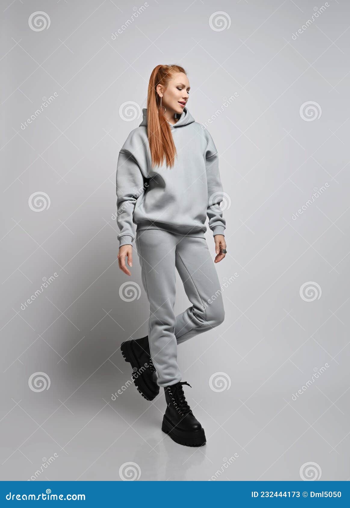 Happy Rich Slim Red-haired Woman in Trendy Grey Sportswear Hoodie, Pants  and Black Shoes Walks, Looking Down Stock Image - Image of lifestyle,  looking: 232444173