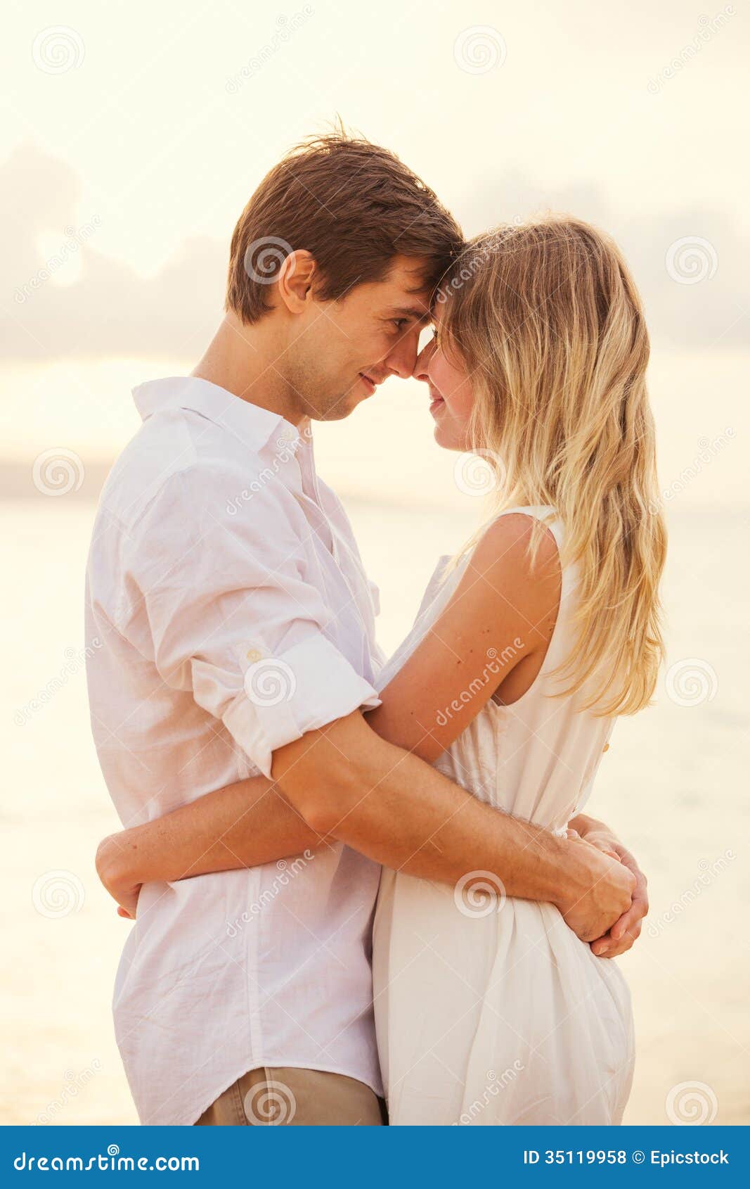 Happy Romantic Couple Having Loving Moment Touching Foreheads Stock