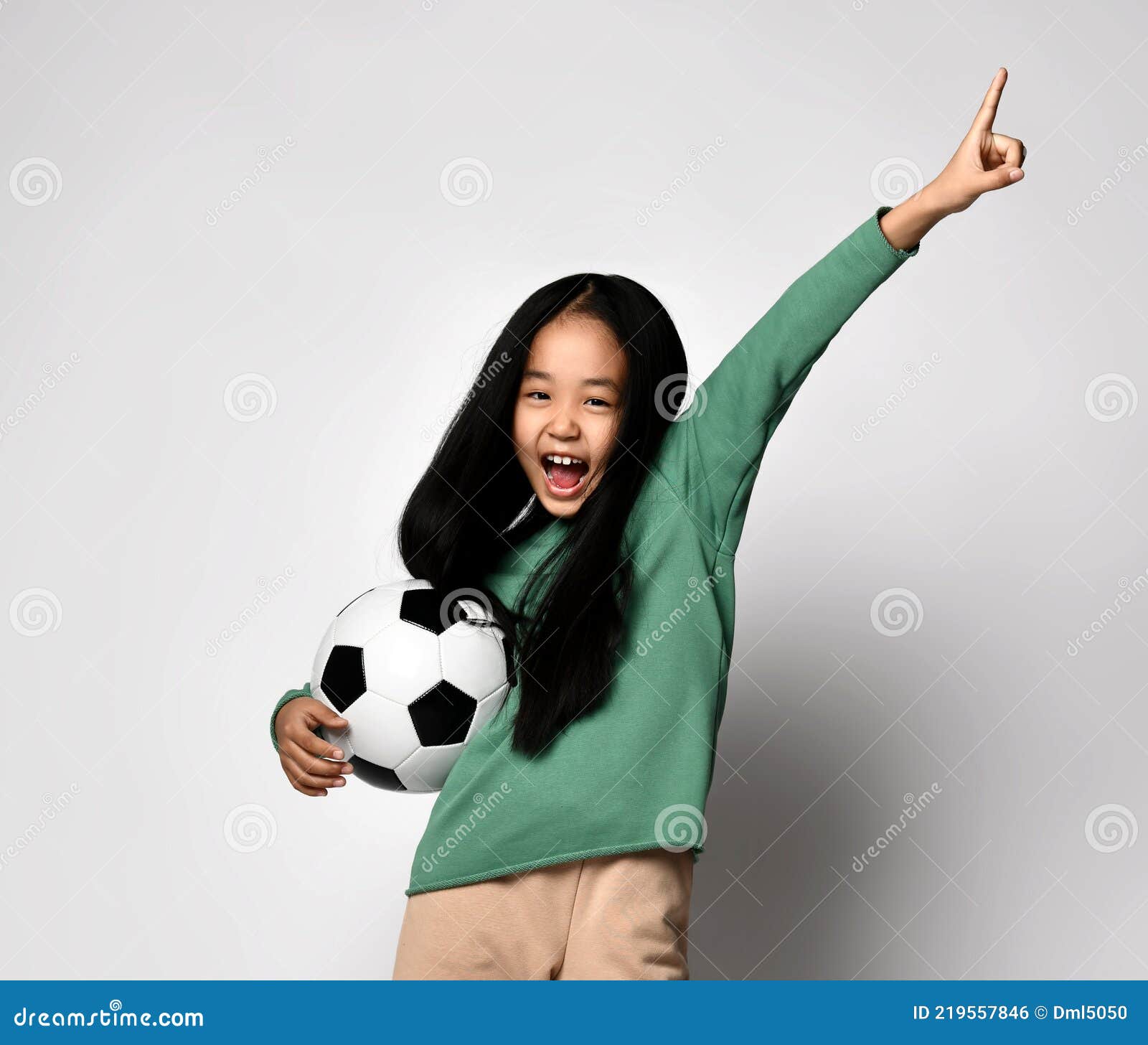 Happy Screaming Asian Kid Girl Holding Soccer Football Ball in One Hand ...