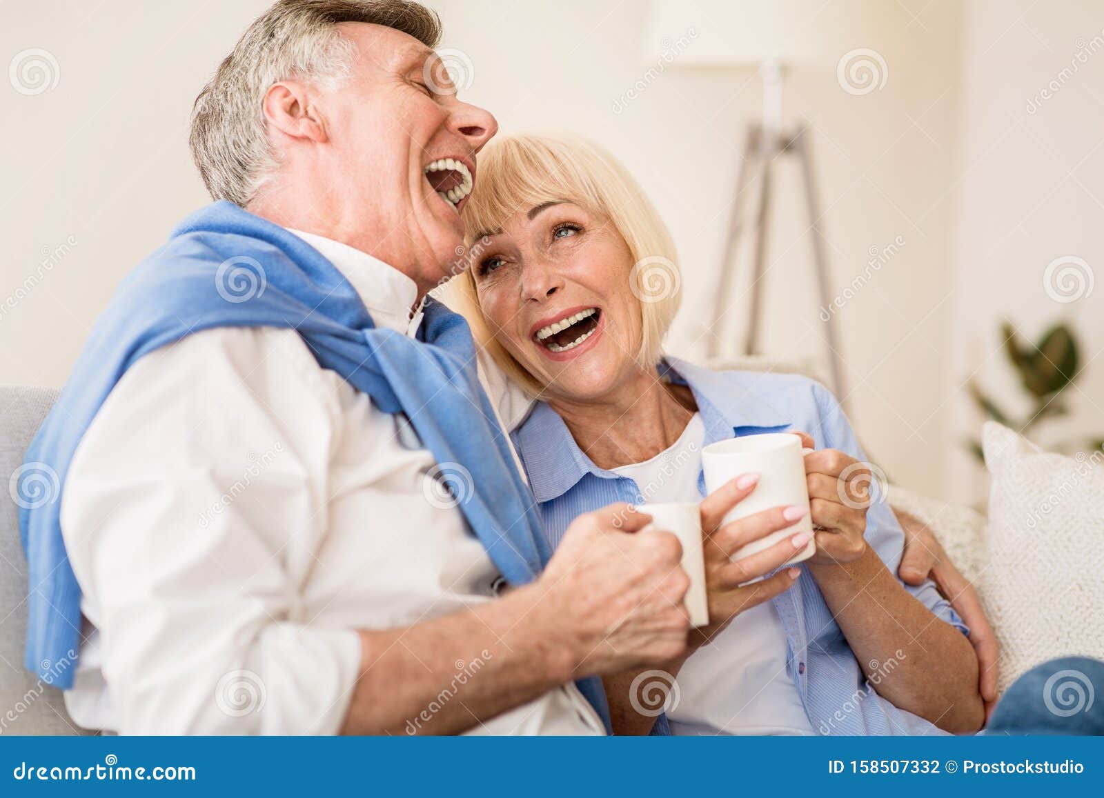 Happy Senior Couple Enjoying Tea And Laughing Stock Photo - Image of ...