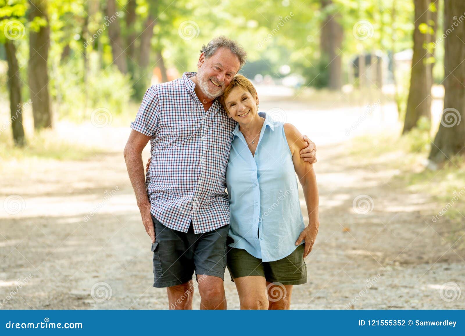 happy senior couple walking and enjoying life outdoors