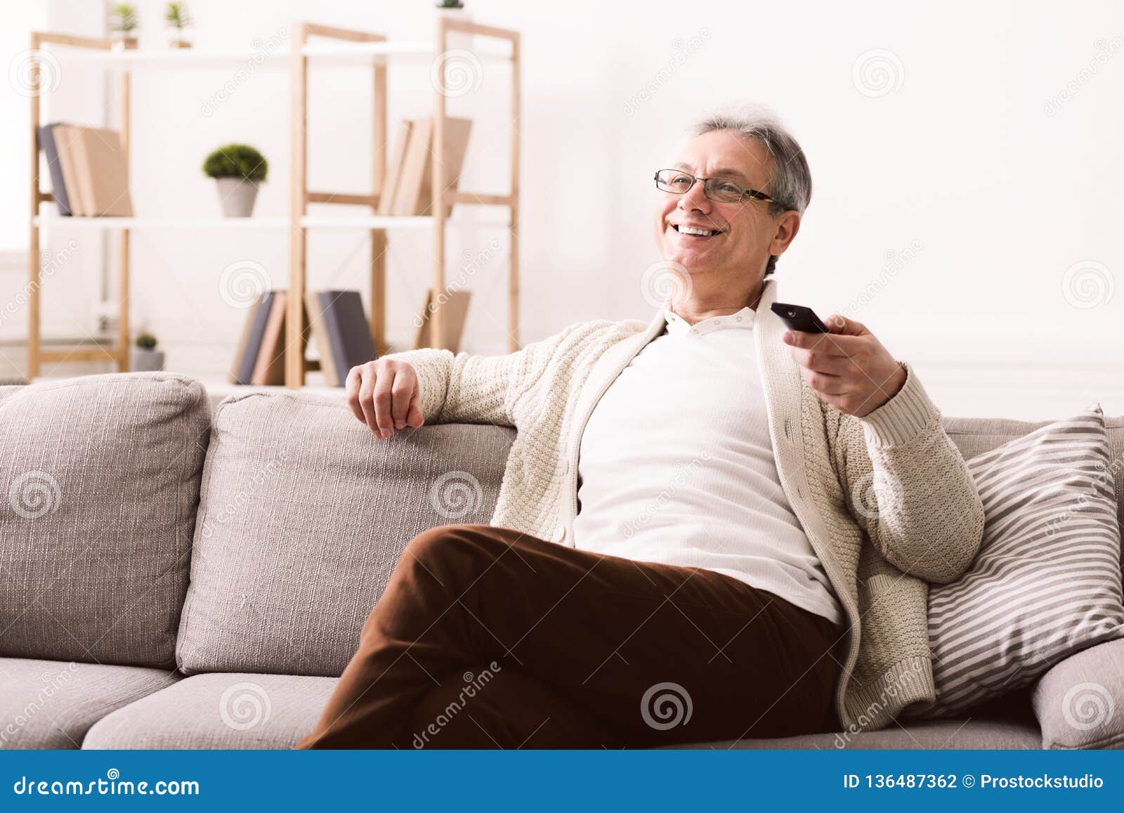 Happy Senior Man Watching Tv, Sitting On Couch Stock Photo Image of remote, hair 136487362
