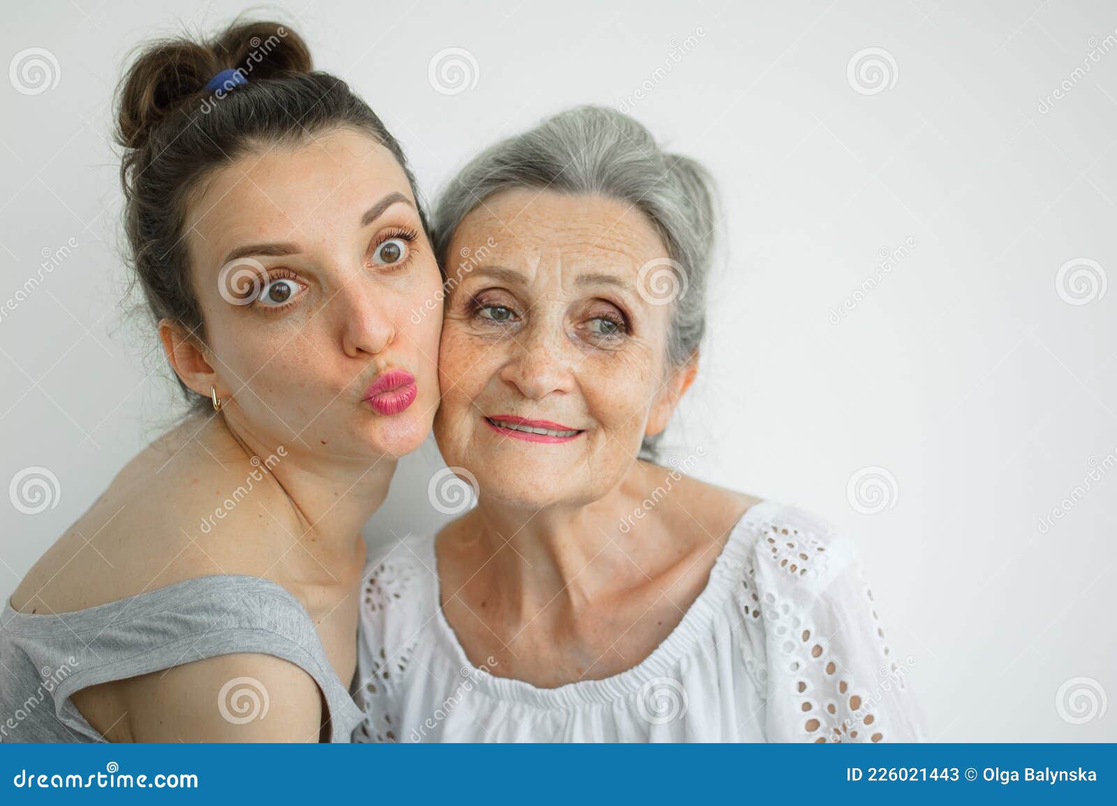 Happy Senior Mother Is Hugging Her Adult Daughter The Women Are Laughing Together Sincere