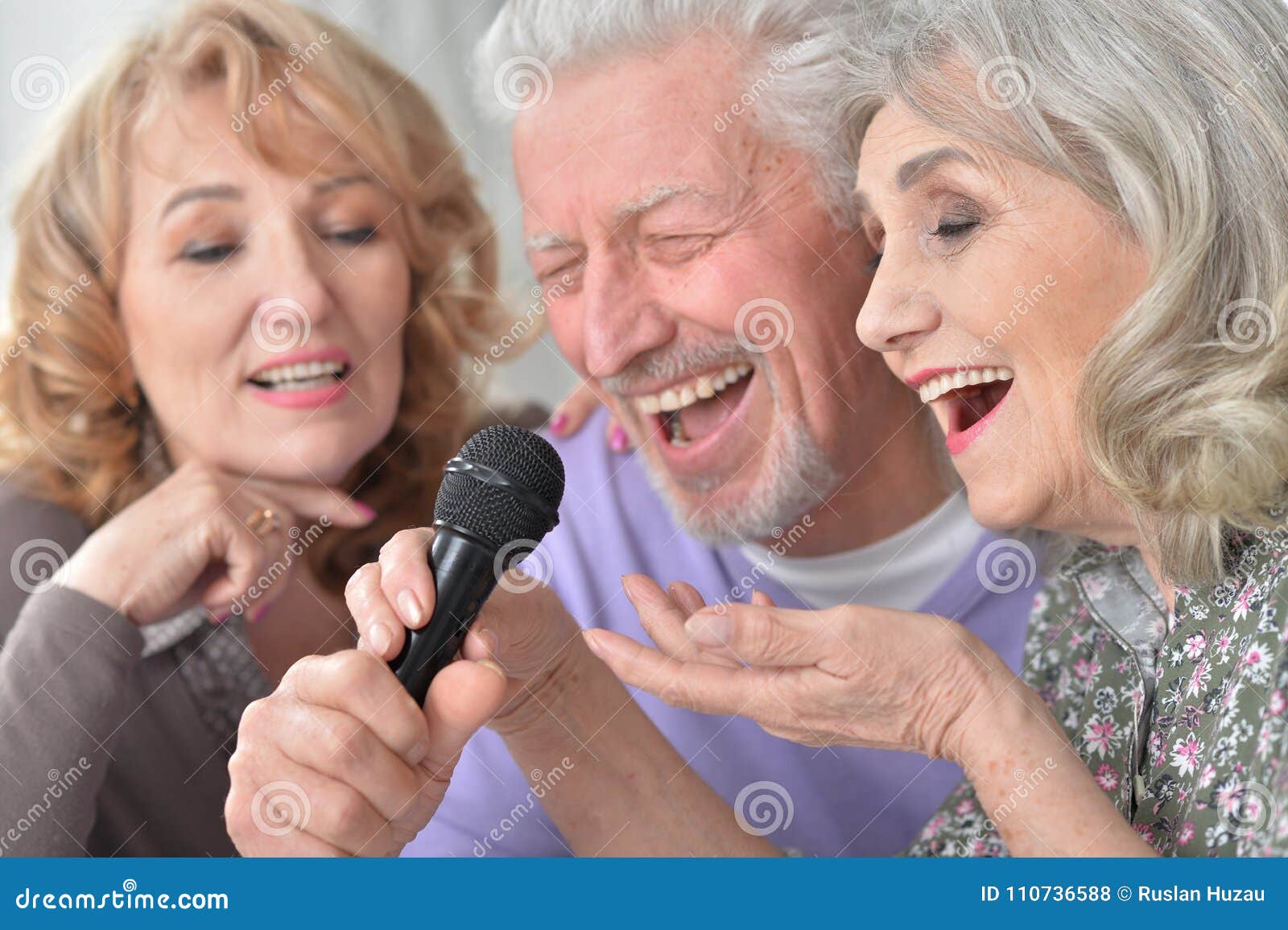 senior people singing karaoke