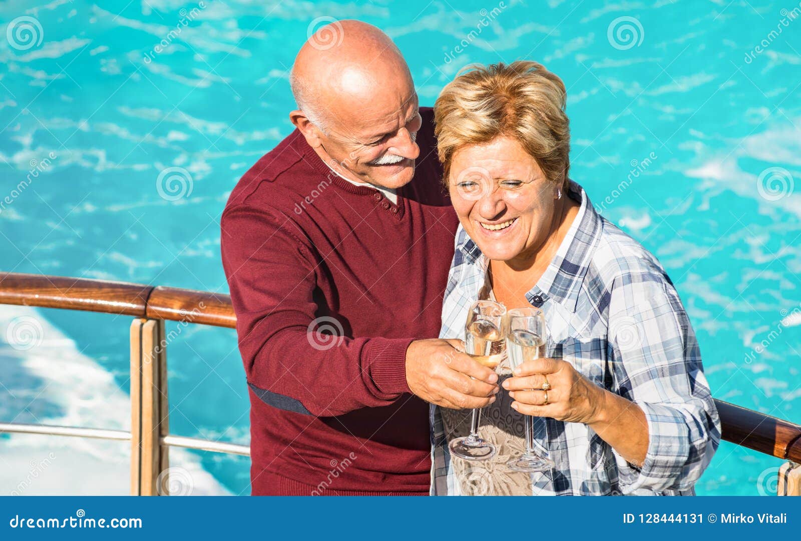 happy senior retired couple having fun outdoors at travel vacation