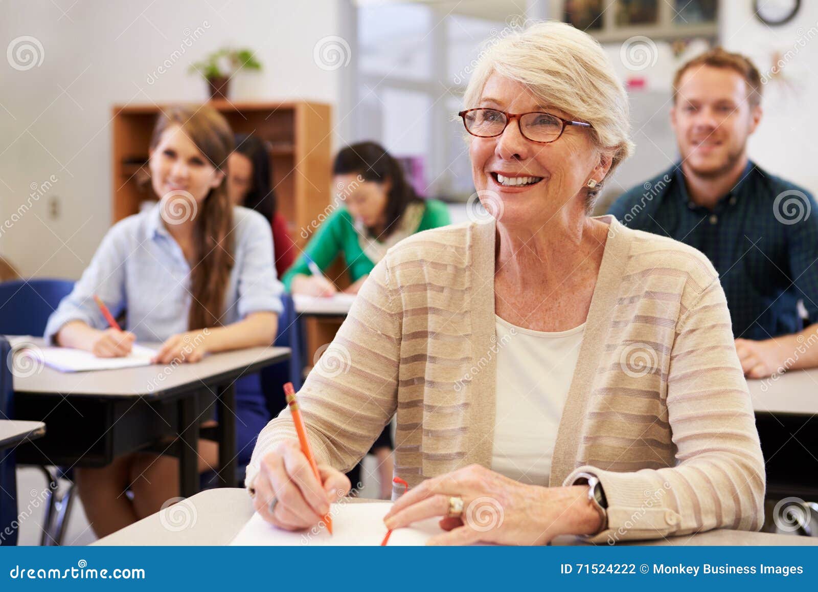 happy senior woman at an adult education class looking up