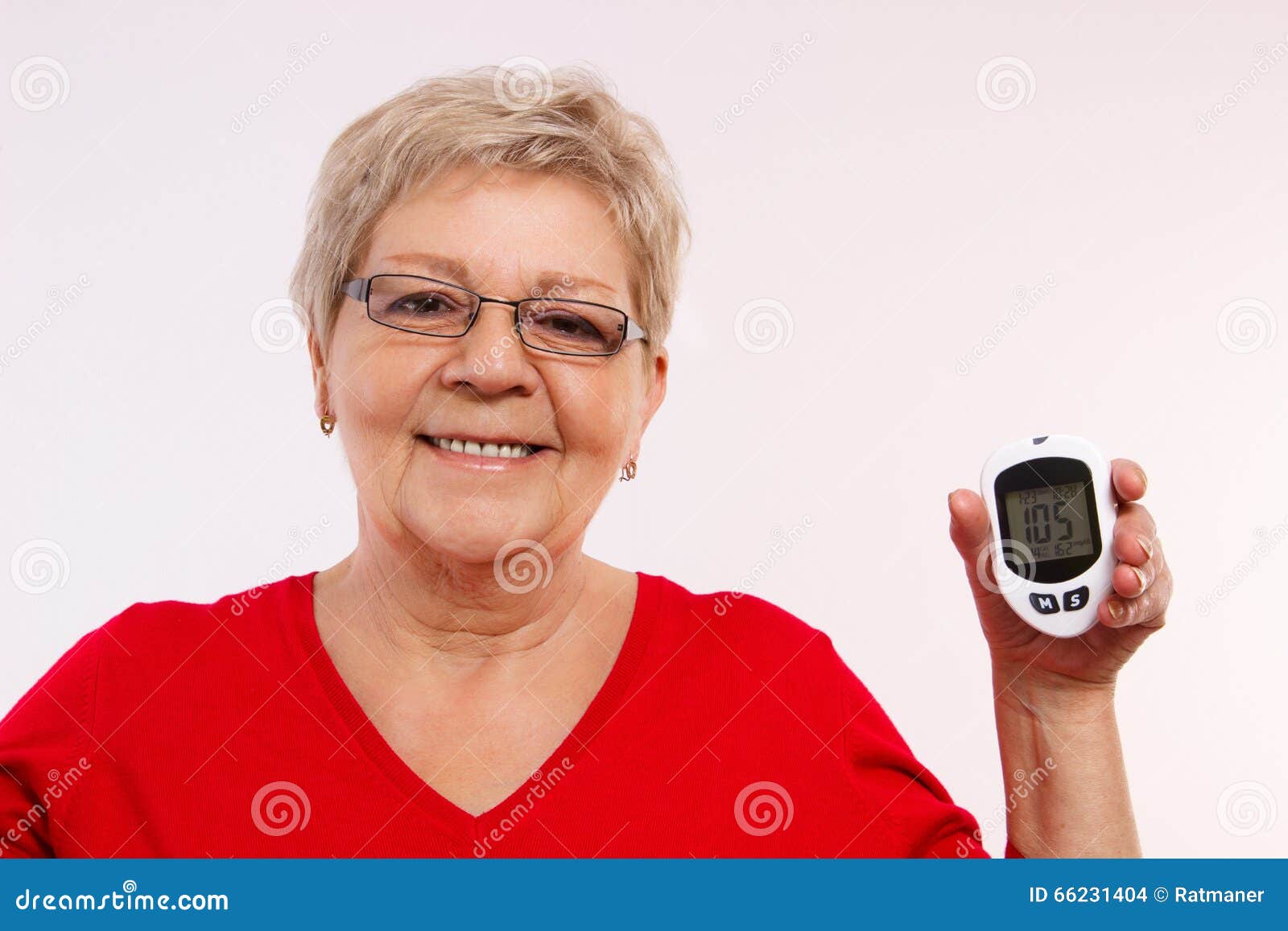 Happy Senior Woman Holding Glucometer Measuring And Checking Sugar