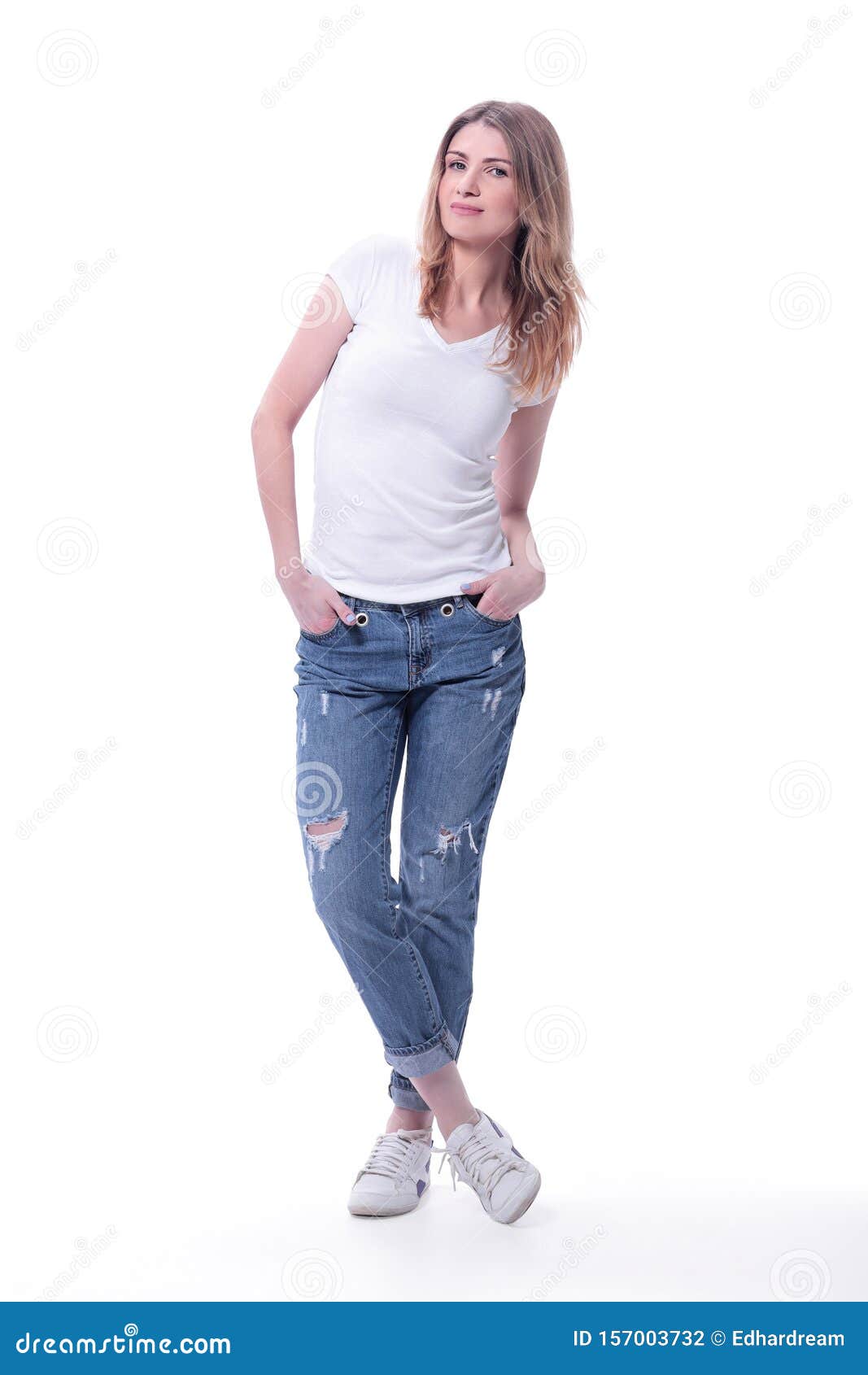 Pretty Girl With Hairstyle In Fashion White Tshirt And Blue Vintage Jeans  Sits In Studio Stock Photo  Download Image Now  iStock