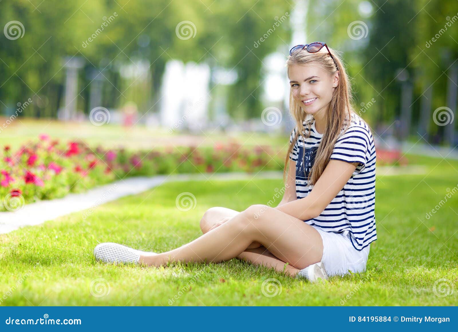 Happy Smiling Caucasian Teenage Girl Posing on the Grass in Green ...