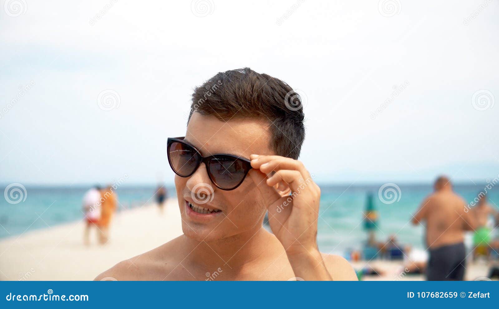 Happy Smiling Handsome Young Teen Smile and Correct His Hairstyle and  Sunglasses on Beach Stock Image - Image of happiness, freedom: 107682659
