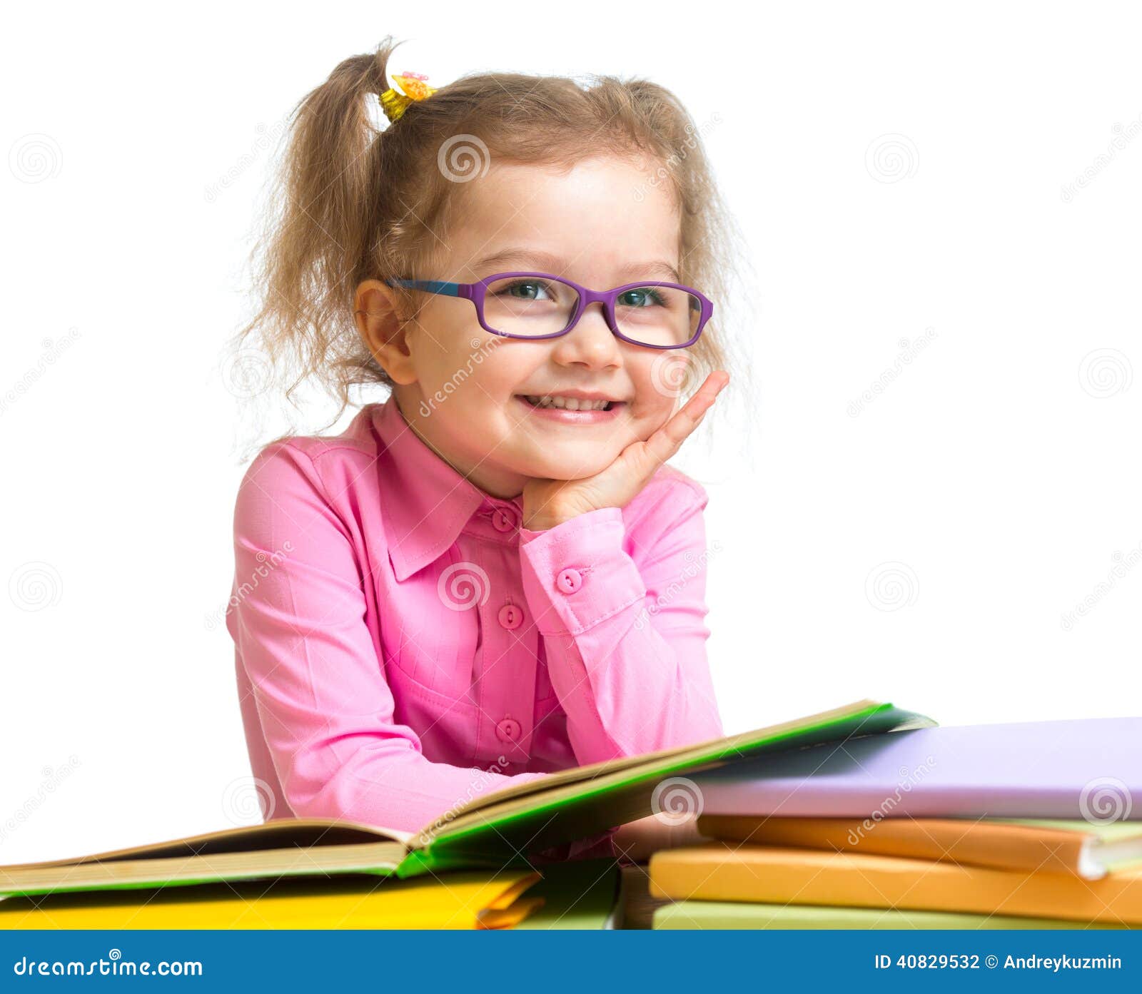 happy smiling kid girl in glasses reading books