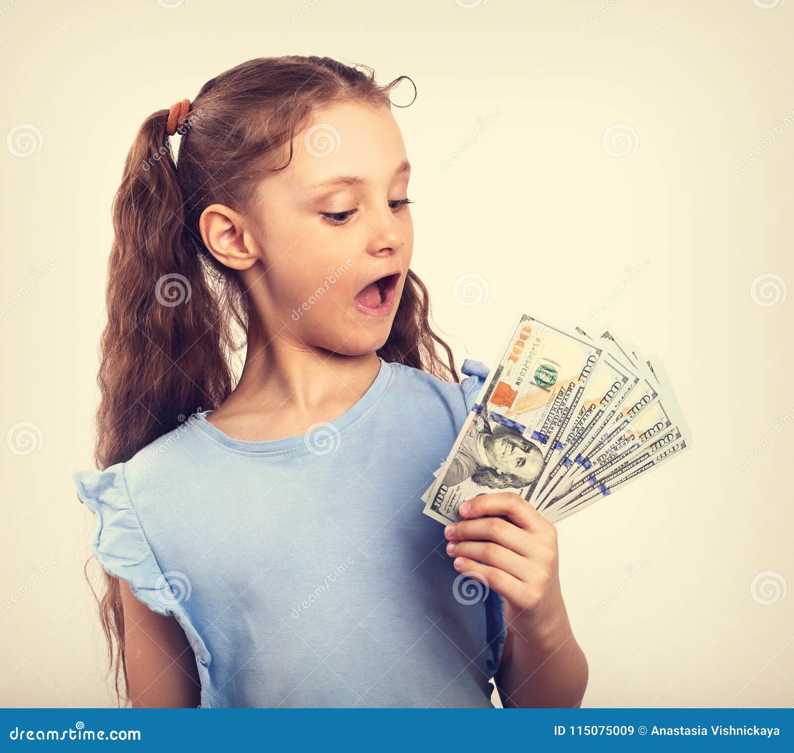 Happy Smiling Kid Girl Holding Money with Surprising Emotion and Stock ...