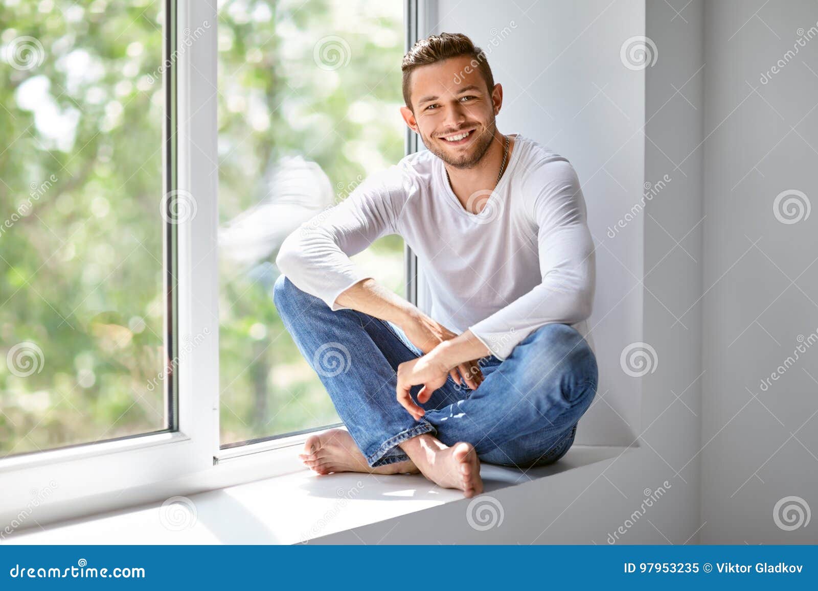 HD wallpaper: Man sitting on a window sill, looking out at night