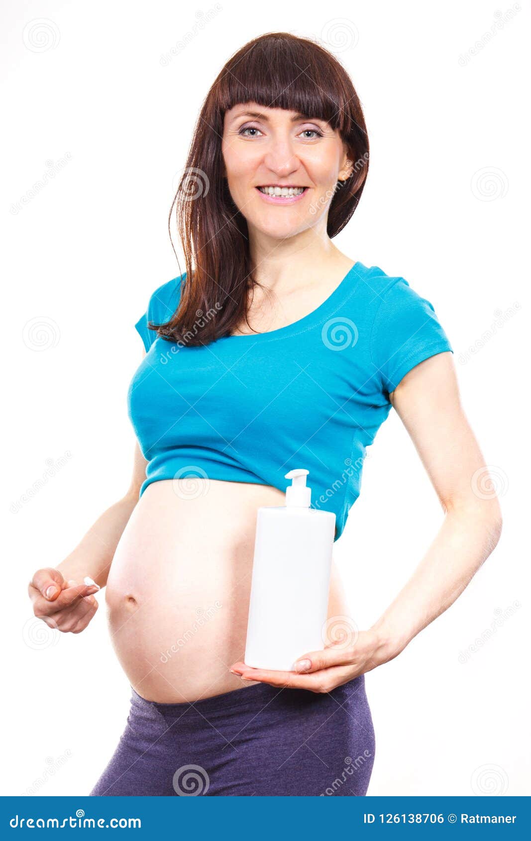 Pregnant Woman Applying Moisturi