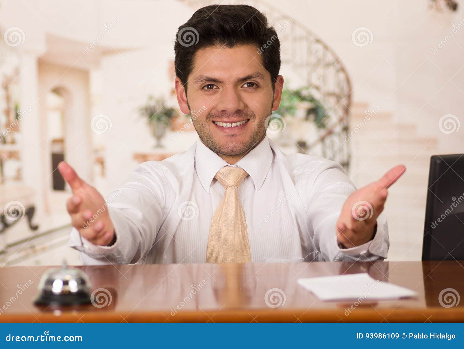 Happy Smiling Receptionist in Hotel Looking Friendly for the Guests
