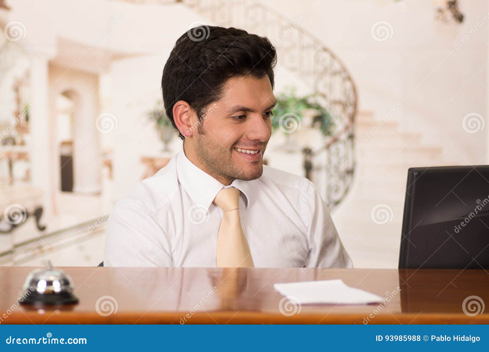 Happy Smiling Receptionist in Hotel Looking Friendly for the Guests in