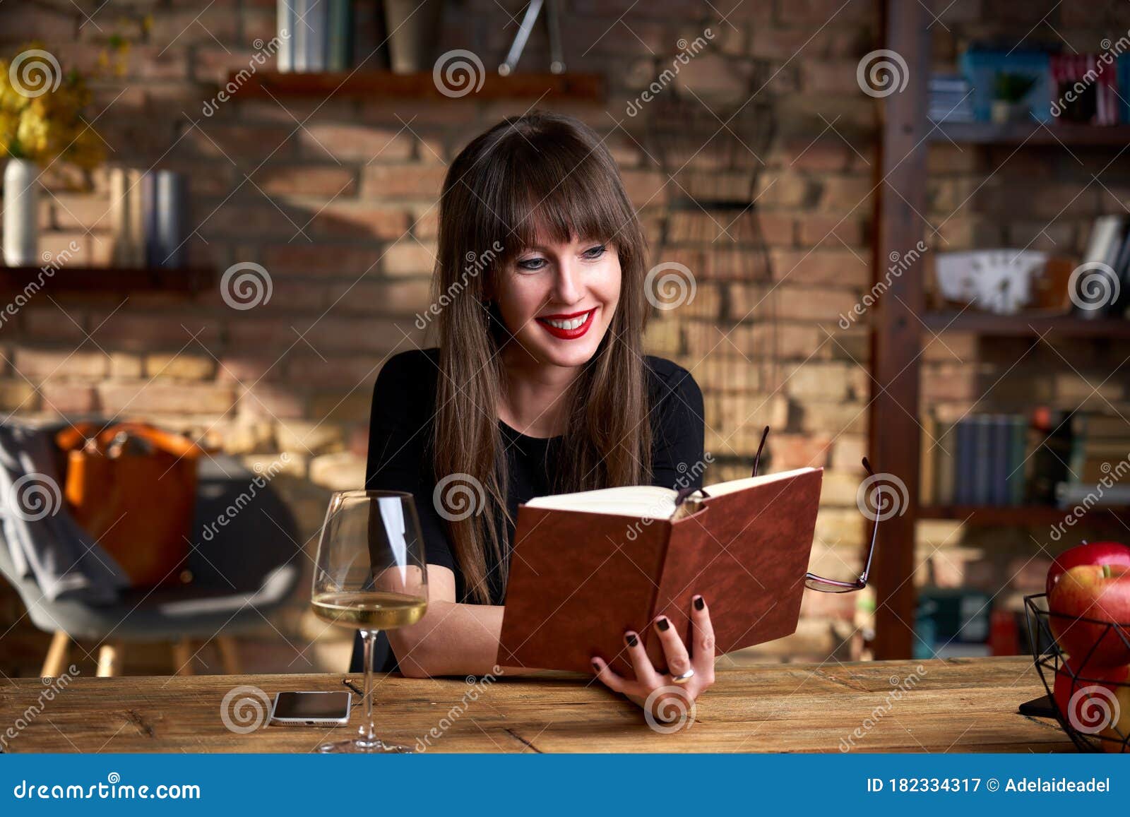 Happy Smiling White Woman Reading Book at Home in the Living Room ...