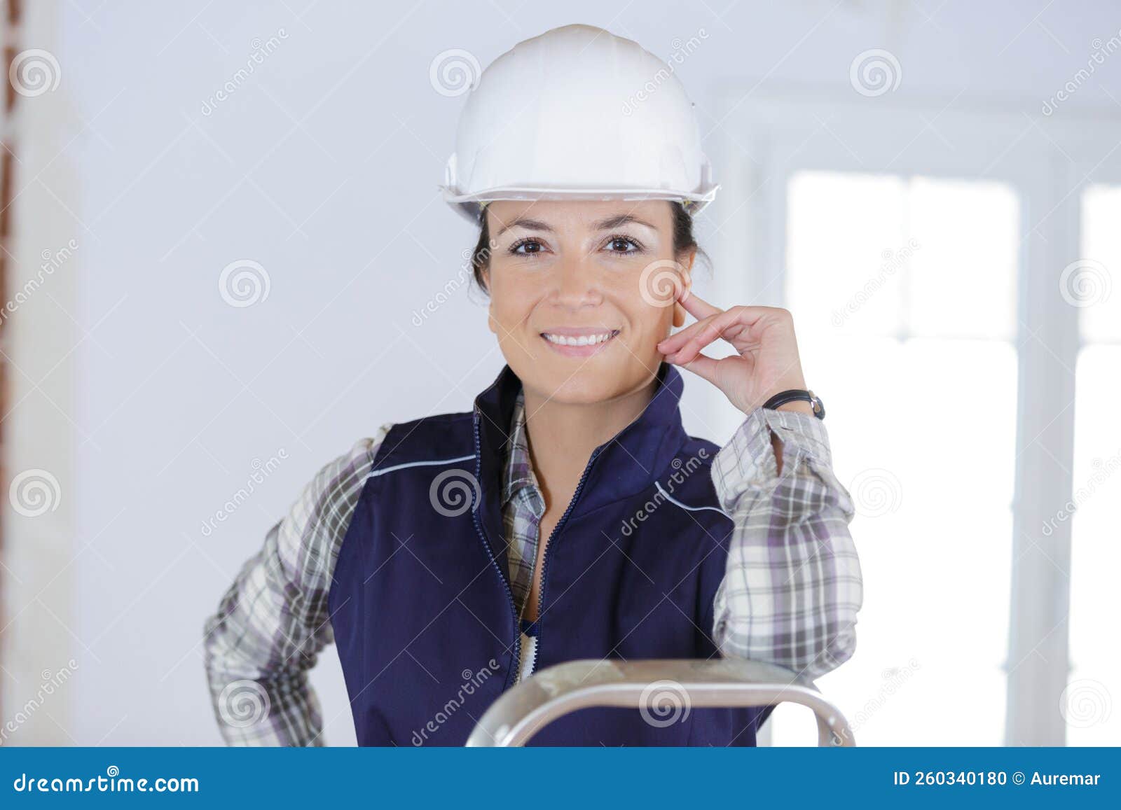 happy smiling worker with arms corssed