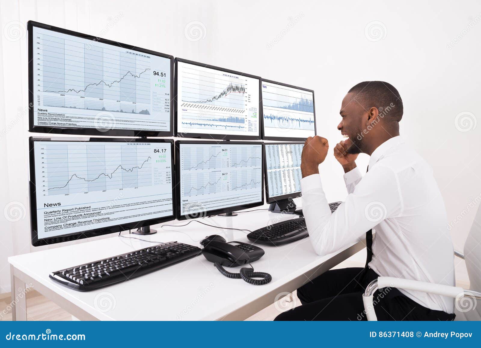 Happy Stock Market Broker Looking At Graphs On Multiple ...