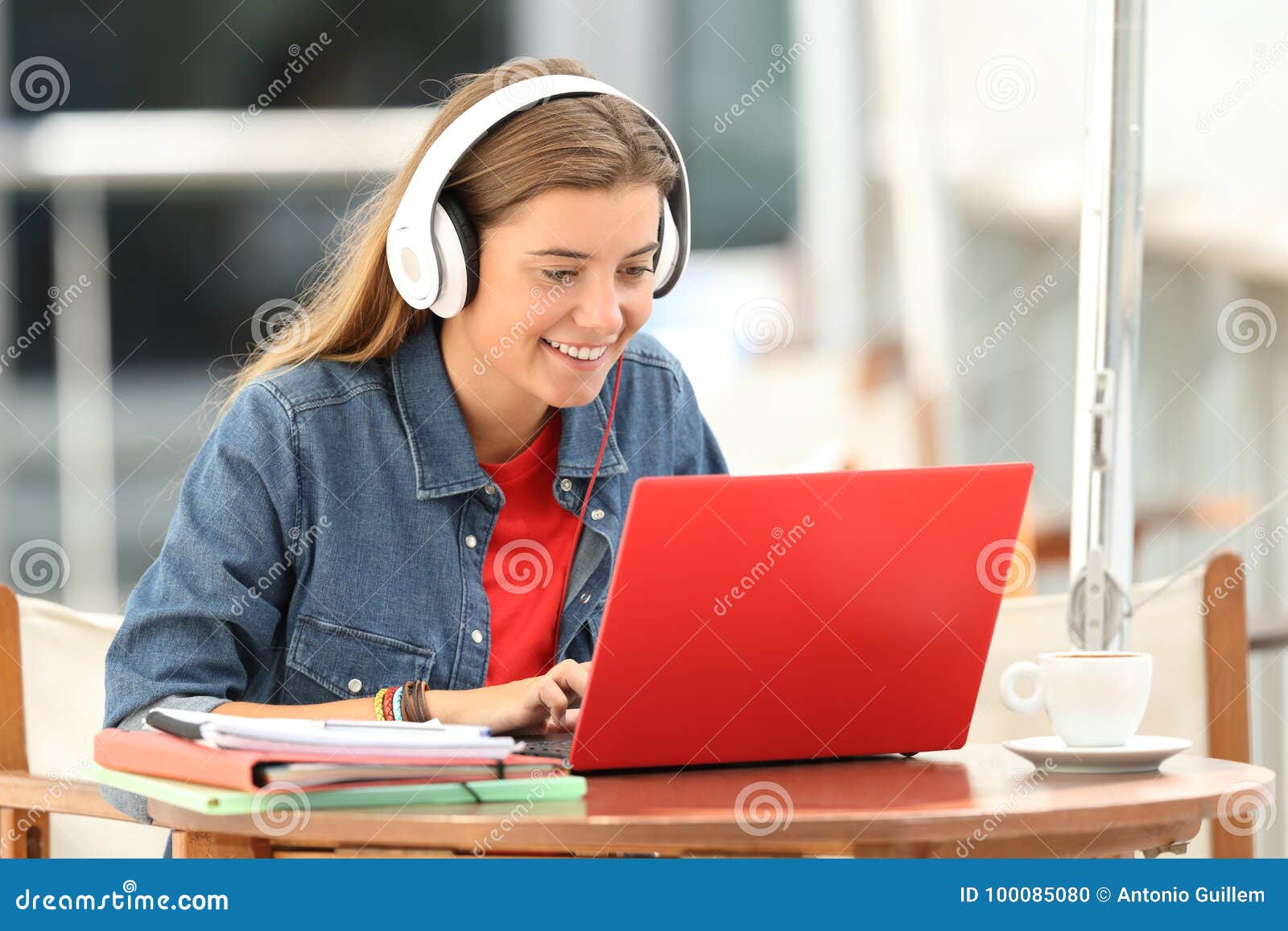 happy student listening a video tutorial on line